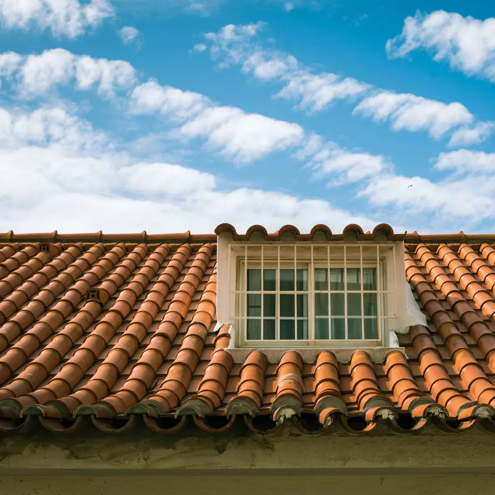 Terracotta clay tile roof with dormer window on a residential home in Brandon, FL